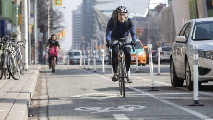 cyclist westbound on Bloor near St. George St.